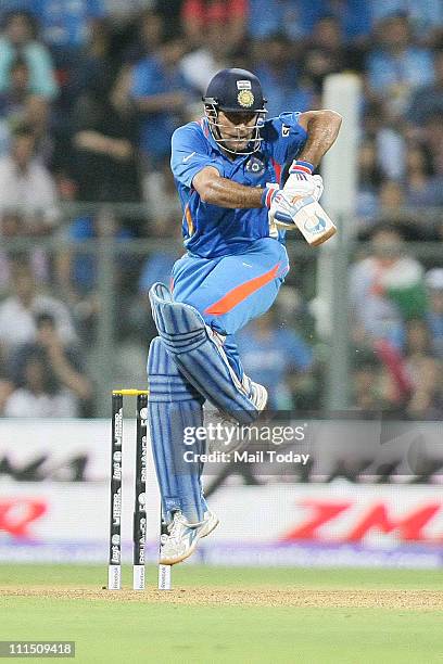 Indian captain Mahendra Singh Dhoni in action during the ICC Cricket World Cup 2011 Final match at The Wankhede Stadium in Mumbai on April 2, 2011....