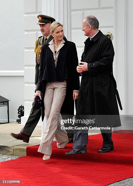 Charlene Wittstock, fiancee to His Serene Highness, Prince Albert II Of Monaco, and Martin McAleese attend a ceremonial welcome and tree planting at...