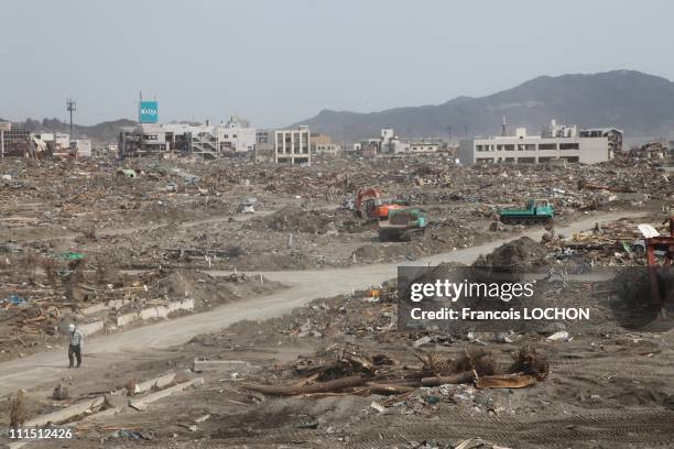 Man walks down the road amid the debris April 2, 2011in Rikusen Takata City, Japan. The 9.0 magnitude strong earthquake struck offshore on March 11...