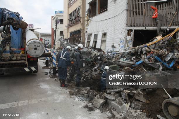 Men dig to install a power pole April 2, 2011 in Kamaishi, Japan. The 9.0 magnitude strong earthquake struck offshore on March 11 at 2:46pm local...