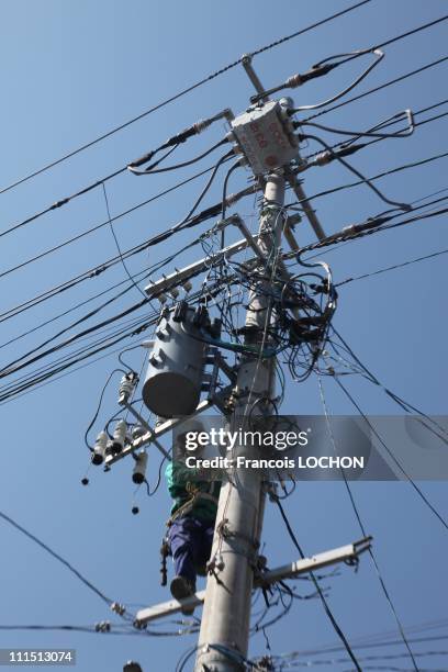 Life takes over after the passage of the devastating tsunami on last March 11th technicians of the electric company of Japan build a new network for...