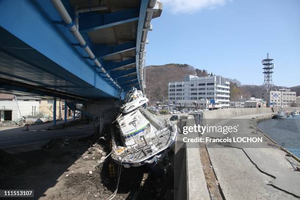 Boat sits under an underpass April 3, 2011 in Myako City, Japan. The 9.0 magnitude strong earthquake struck offshore on March 11 at 2:46pm local...