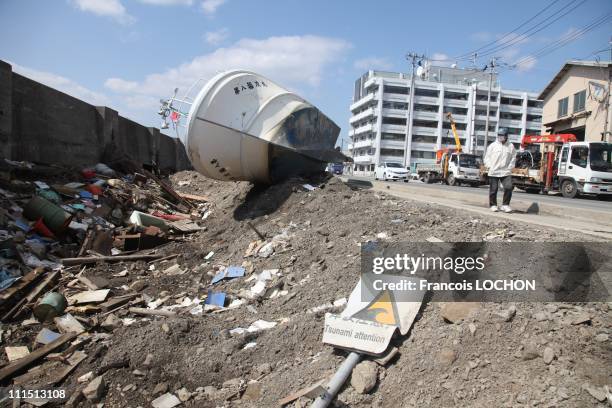 Tsunami warning sign sits on the ground April 3, 2011 in Myako City, Japan. The 9.0 magnitude strong earthquake struck offshore on March 11 at 2:46pm...