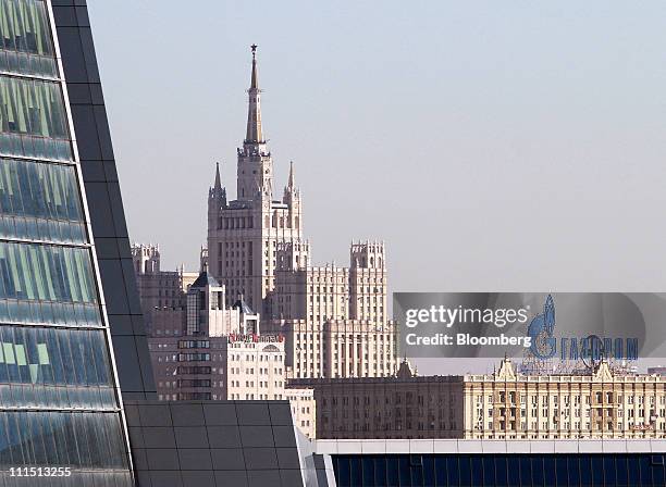 The logo of OAO Gazprom sits on display above a building on the skyline of Moscow, Russia, on Monday, April 4, 2011. OAO Gazprom Neft , the liquids...