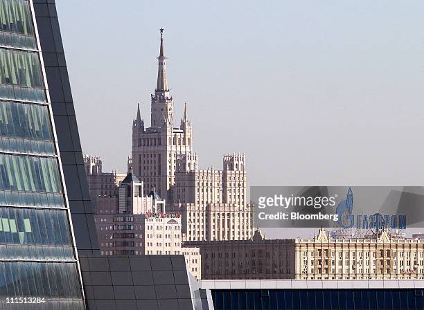 The logo of OAO Gazprom sits on display above a building on the skyline of Moscow, Russia, on Monday, April 4, 2011. OAO Gazprom Neft , the liquids...