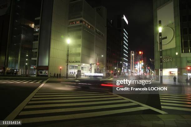 Most of he lights on Ginza Ave. Are darkened due to an energy saving program April 3, 2011 in Tokyo, Japan. The major shopping steeet Ginza Ave,...