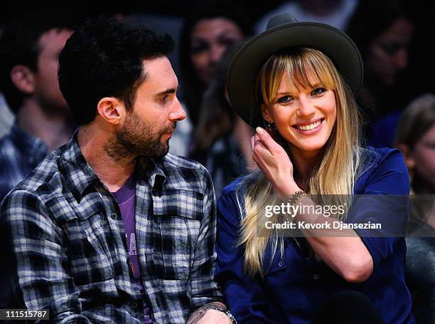 Adam Levine singer of the band Maroon 5 and Russian model Anne V attend the Denver Nuggets and Los Angeles Lakers basketball game at Staples Center...