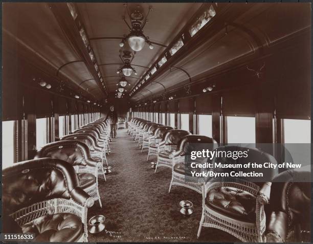 Pullman car on an Erie Railroad Co. Train, wicker chairs, spittoons and porter, New York, New York, 1903.