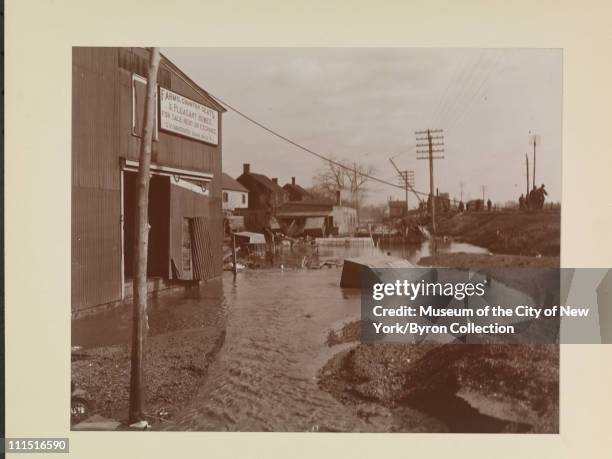 Flood waters at Bound Brook N.J. With sign reading 'Farms, Country Seats, & Pleasant Homes for Sale, Rent or Exchange, G.V. Vandoren, Bound Brook,...