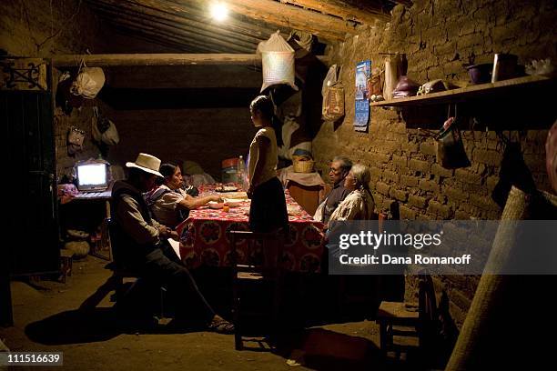 The Cruz family eat dinner in their kitchen on February 20, 2008 in the small town of San Marcos Tlapazola in Tlacolula. The mother, Rafaela,...
