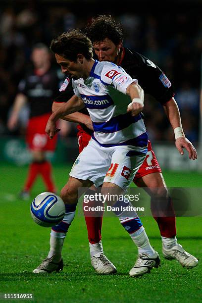 Tommy Smith of QPR in action against Darius Henderson of Sheffield during the npower Championship match between Queens Park Rangers and Sheffield...