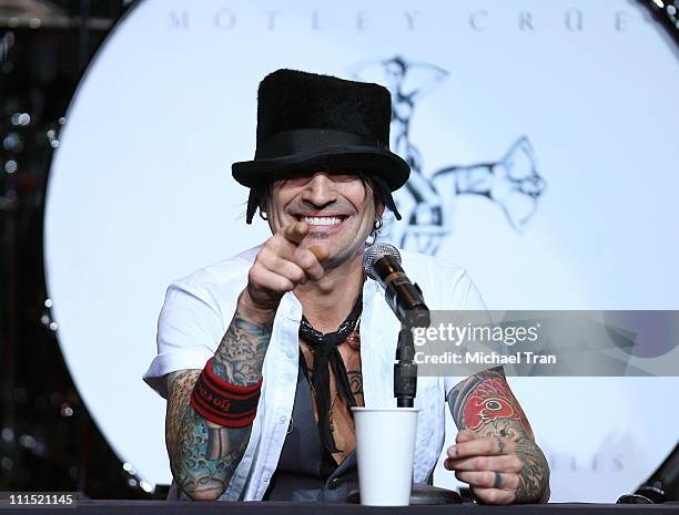 Drummer of Motley Crue Tommy Lee performs on stage at the press conference announcing "Crue Fest 2008: The Summer's Loudest Show on Earth" held at...