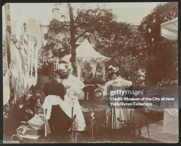 Women setting up a garden party at 37th Street and 5th Avenue to benefit Barnard College, New York, New York, 1896.