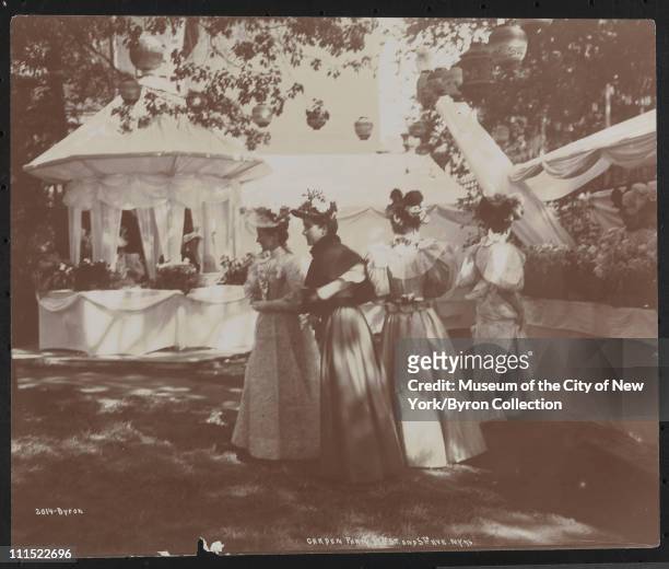 Women at a garden party at 37th Street and 5th Avenue to benefit Barnard College, New York, New York, 1896.