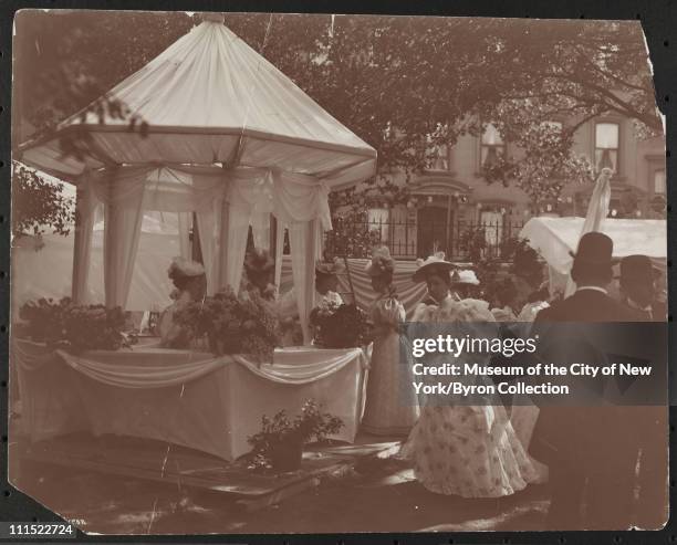Men and women at a garden party at 37th Street and 5th Avenue to benefit Barnard College, New York, New York, 1896.