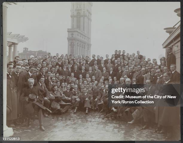 Large group of men, posed, at a fraternity convention of Alpha Delta Phi atop the Hotel Astor with Times Building in background, New York, New York,...