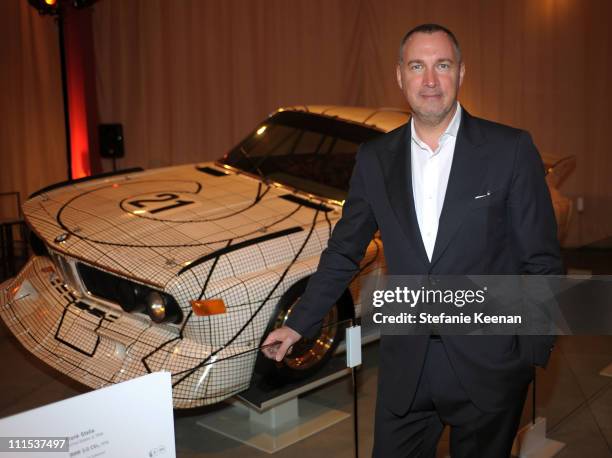 Vanity Fair publisher Edward Menicheschi admires the BMW Art Car by Frank Stella at a celebration hosted by Vanity Fair at LACMA on February 18, 2009...