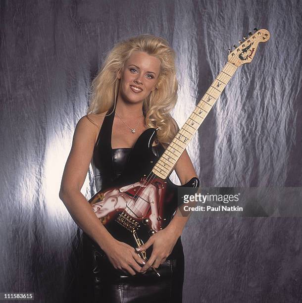 Jenny McCarthy with a Fender/Playboy Marilyn Monroe Guitar on 4/15/93 in Chicago, Il..