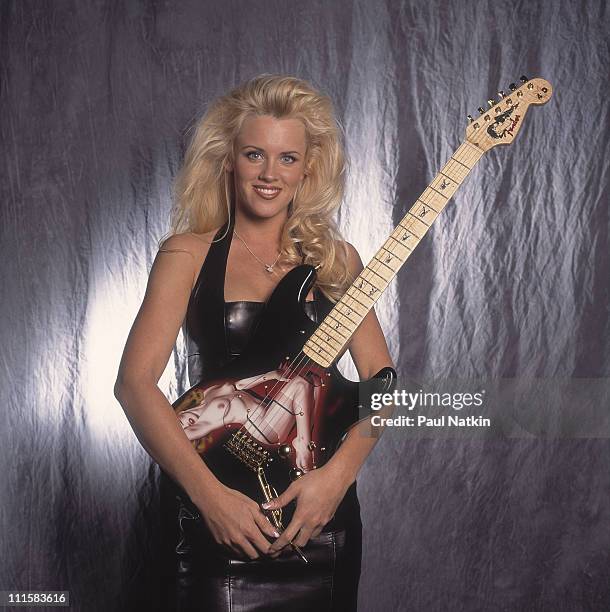 Jenny McCarthy with a Fender/Playboy Marilyn Monroe Guitar on 4/15/93 in Chicago, Il..