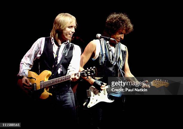 Tom Petty and Bob Dylan during Bob Dylan and Tom Petty in Concert - July 22, 1986 at Poplar Creek Music Theater in Chicago, Illinois, United States.