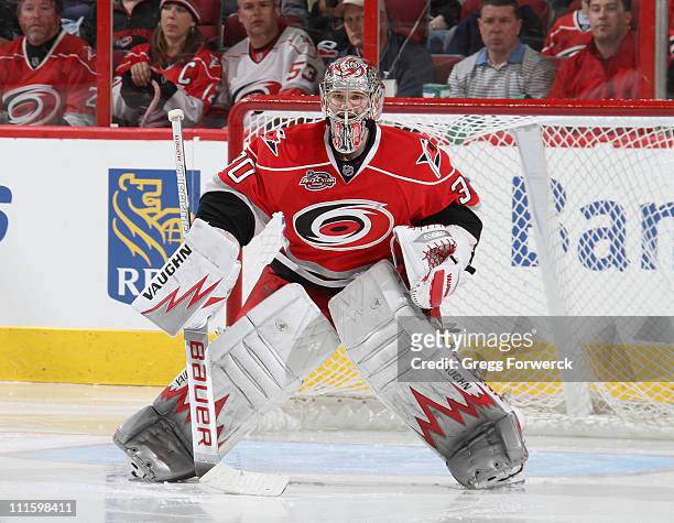 Cam Ward of the Carolina Hurricanes defends the net during an NHL game against the Buffalo Sabres on April 3, 2011 at RBC Center in Raleigh, North...