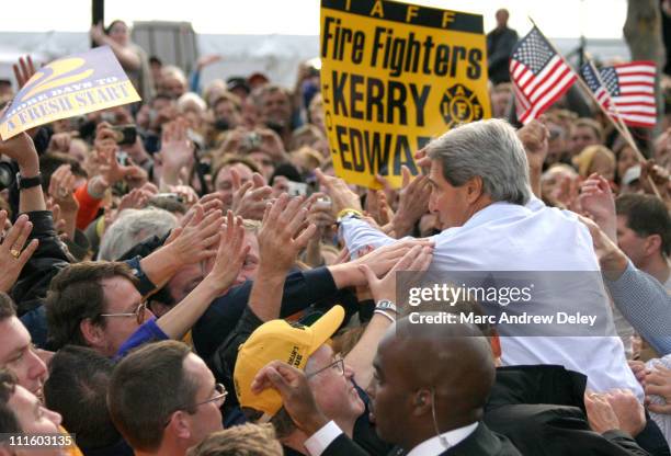 Senator John Kerry greets the crowd of supporters after a late afternoon rally in Manchester, New Hampshire on Sunday, October 31, 2004. This rally...