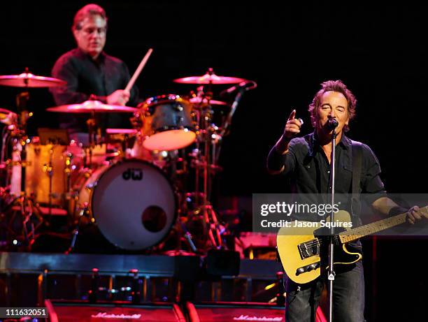 Singer/musician Bruce Springsteen and drummer Max Weinberg perform at Sprint Center on August 24, 2008 in Kansas City, Missouri.