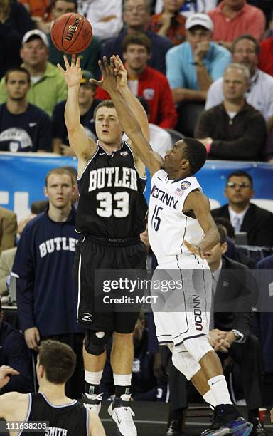 Butler's Chase Stigall shoots over Kemba Walker of Connecticut during the second half of the NCAA Men's Basketball Final at Reliant Stadium in...