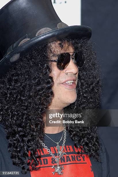 Slash guitarist for Guns N' Roses and Velvet Revolver signs copies of his book "Slash" at Bookends Bookstore on November 1, 2007 in Ridgewood, New...