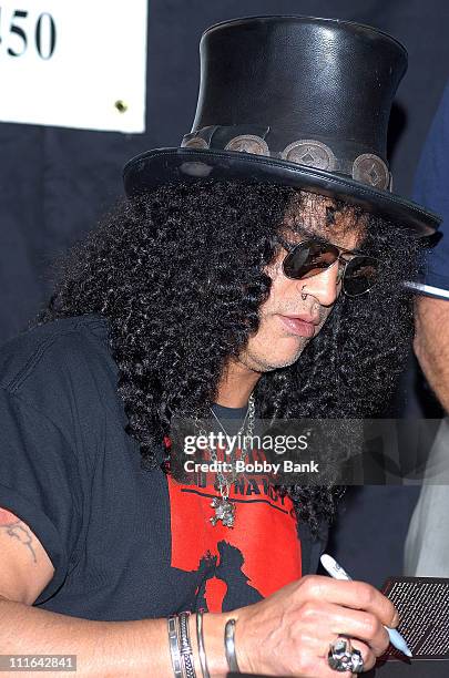 Slash guitarist for Guns N' Roses and Velvet Revolver signs copies of his book "Slash" at Bookends Bookstore on November 1, 2007 in Ridgewood, New...