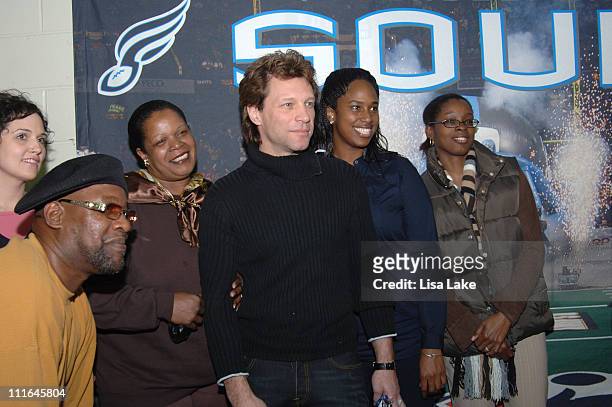 Jon Bon Jovi poses with Project H.O.M.E. Families on November 26, 2007 in Philadelphia Pennsylvania.