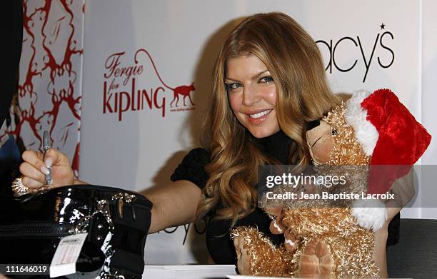 Singer Fergie arrives at Macy's at the South Coast Plaza on December 8, 2007 in Costa Mesa, California.