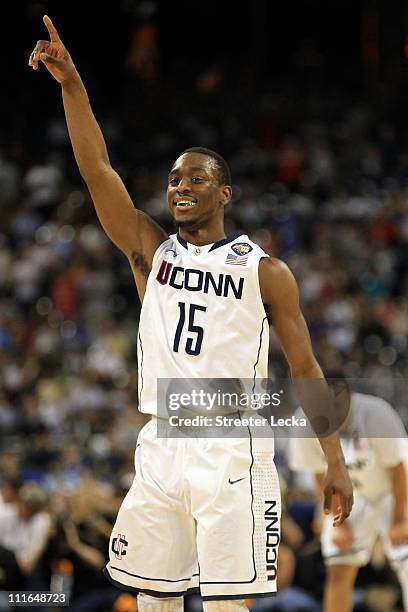 Kemba Walker of the Connecticut Huskies celebrates towards the end of the game against the Butler Bulldogs to win the National Championship Game of...