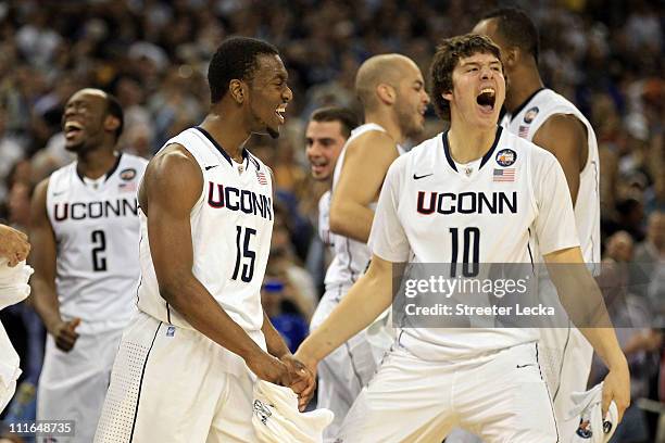 Kemba Walker and Tyler Olander of the Connecticut Huskies react after defeating the Butler Bulldogs to win the National Championship Game of the 2011...