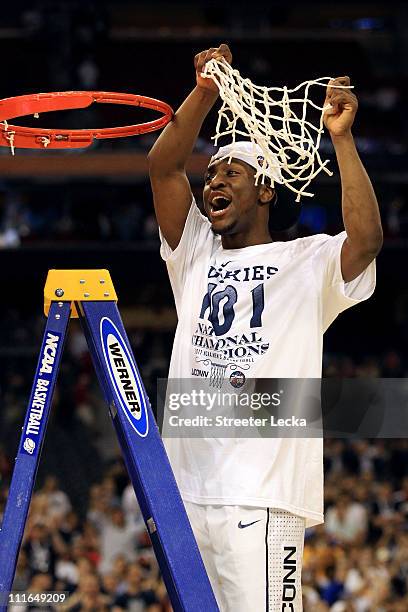 Kemba Walker of the Connecticut Huskies cuts down the net after defeating the Butler Bulldogs to win the National Championship Game of the 2011 NCAA...