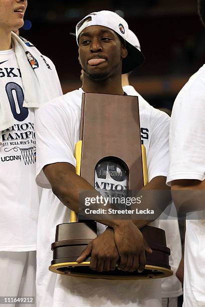 Kemba Walker of the Connecticut Huskies celebrates with the trophy after defeating the Butler Bulldogs to win the National Championship Game of the...