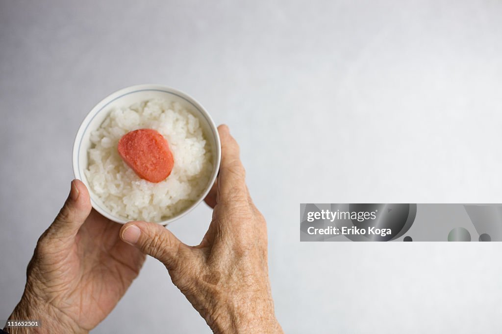 Bowl of rice in Hand