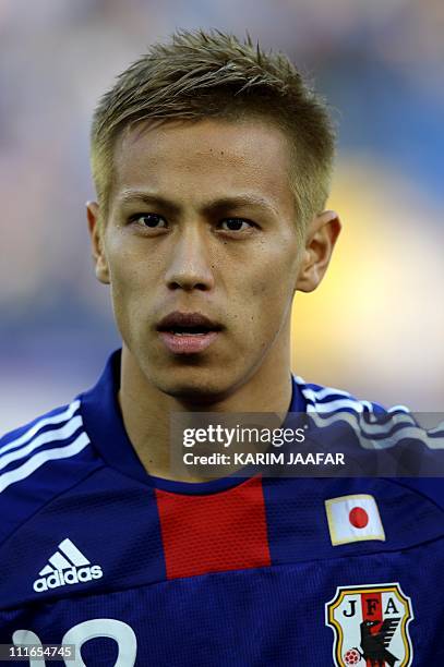 Japan's midfielder Keisuke Honda listens to his national anthem before the start of the 2011 Asian Cup semi-final football match between Japan and...