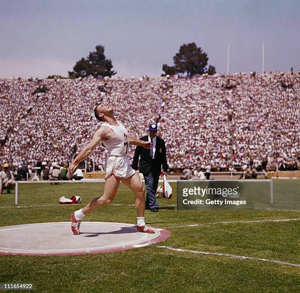 American athlete Al Oerter competes in the discus throw, circa 1965.