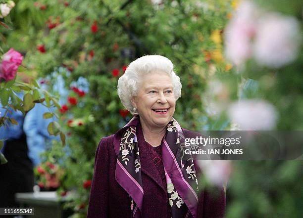 Britain's Queen Elizabeth II braves blustery conditions at the annual Chelsea Flower show in London, 22 May 2006. The rain held off for the 84th...