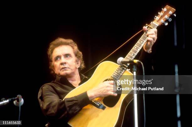 Johnny Cash performs on stage at Glastonbury Festival, June 1994.