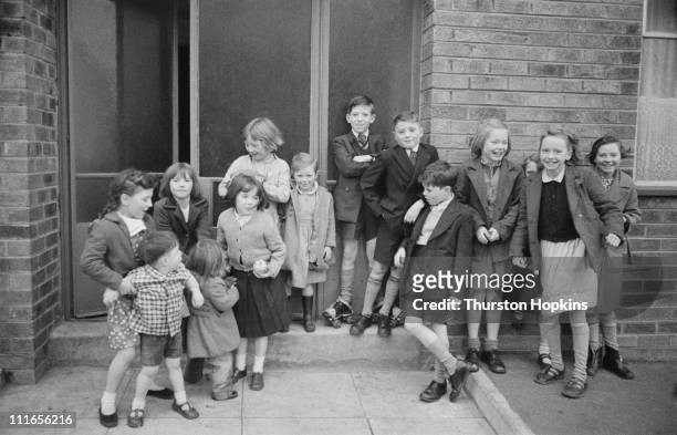 Group of children in a slum area of Liverpool, 19th November 1956. Original publication: Picture Post - 8995 - Liverpool Slums - unpub.