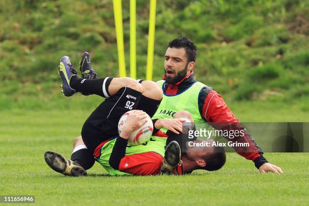 Marcel Heller and Georgios Tzavellas fight during a training session of Eintracht Frankfurt at Commerzbank Arena on April 5, 2011 in Frankfurt am...