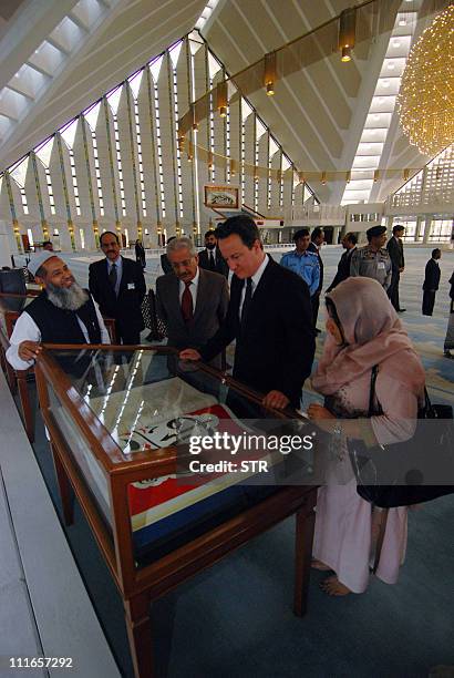 British Prime Minister David Cameron visits the Grand Faisal Mosque in Islamabad on April 5, 2011. Cameron held talks in Pakistan, seeking a "fresh...