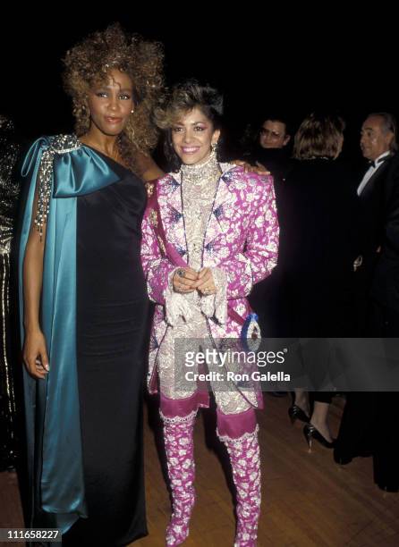 Singer Whitney Houston and musician Sheila E. Attend the 13th Annual American Music Awards on January 27, 1986 at Shrine Auditorium in Los Angeles,...