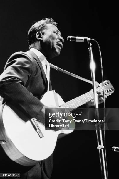 American blues singer and guitarist Muddy Waters performs at the American Folk Blues Festival in London, 1963.