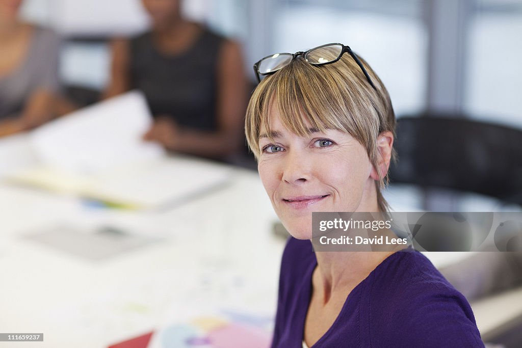 Smiling businesswoman in meeting