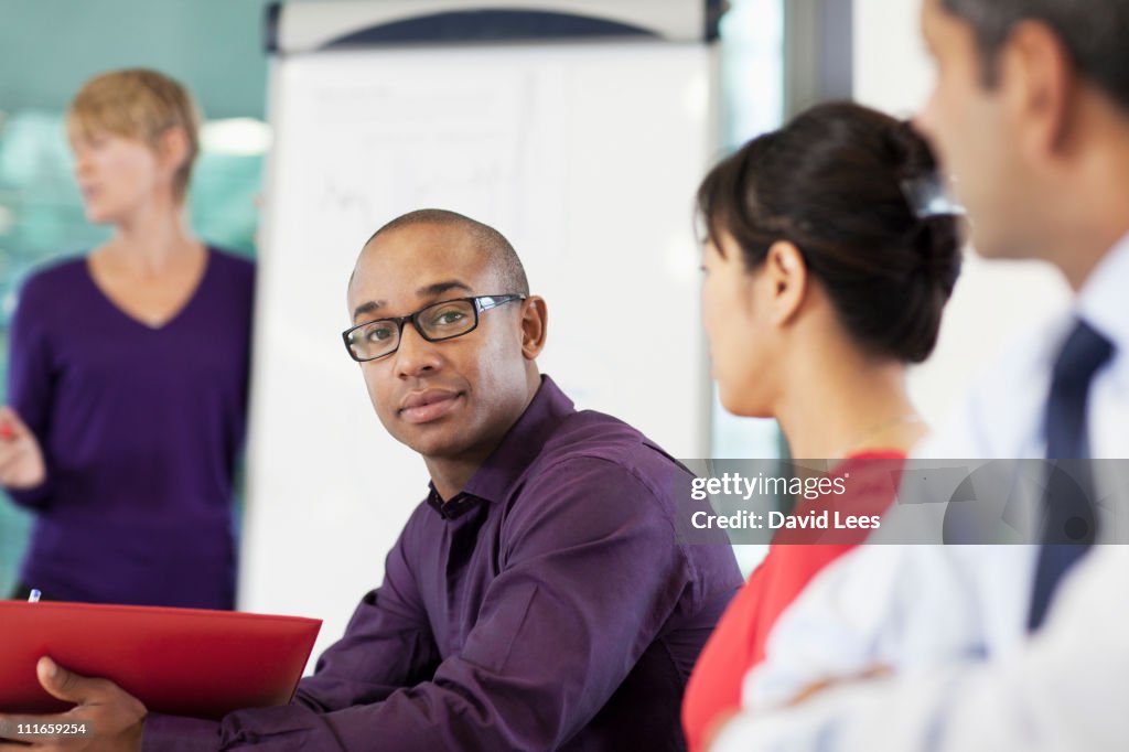 Businesswoman giving presentation in meeting