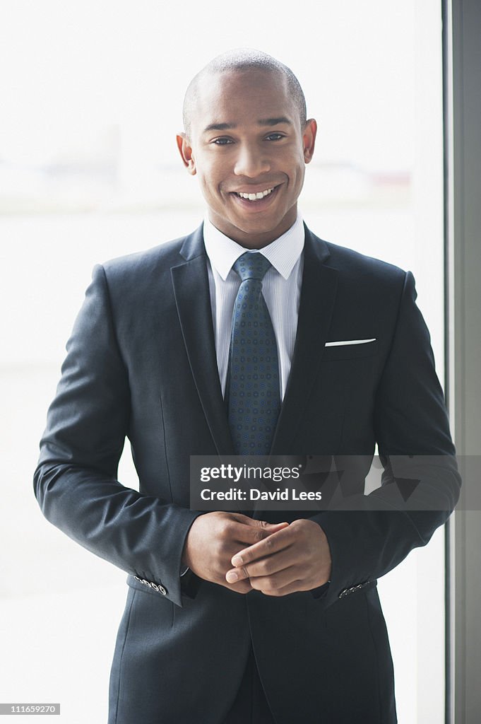 Portrait of businessman, smiling