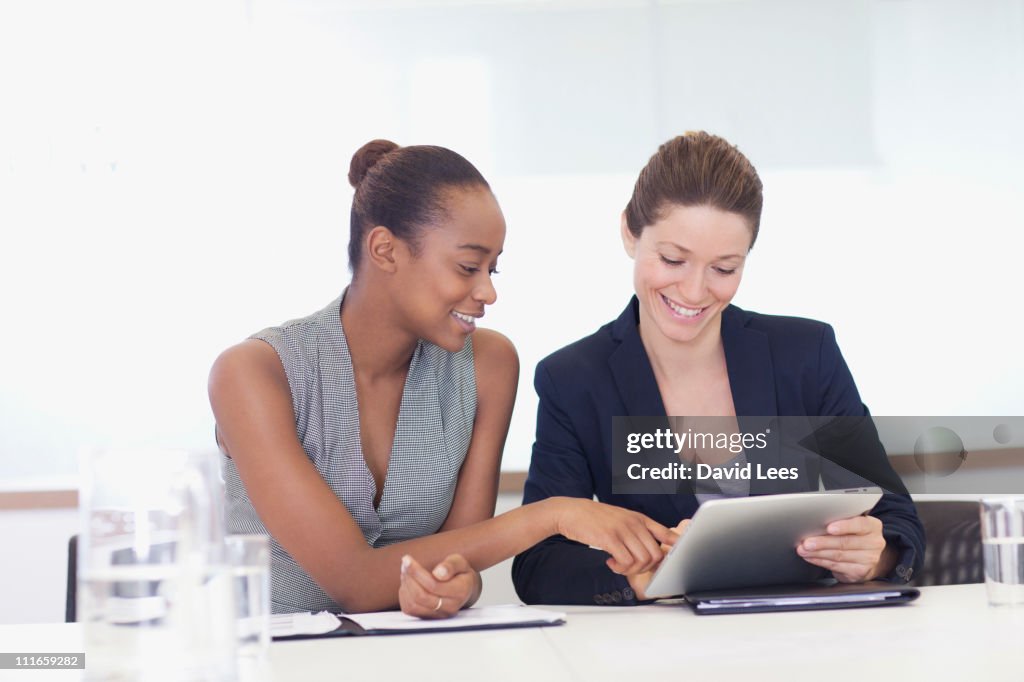 Businesswoman using digital tablet in meeting